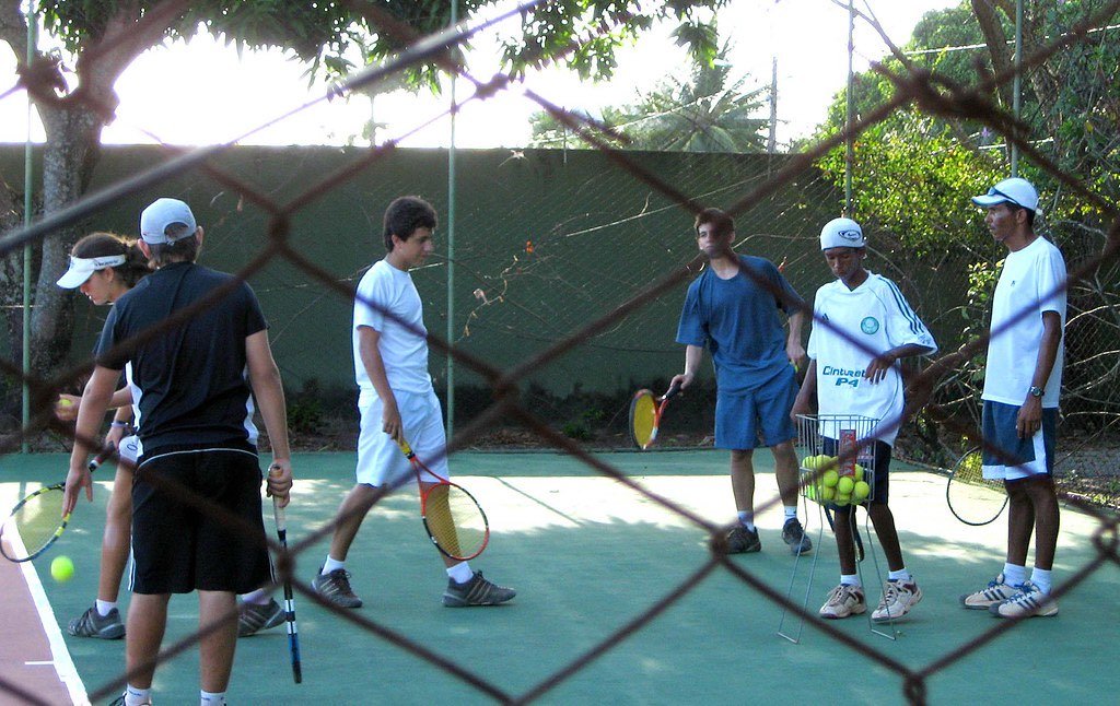 two players running a cross-court dinking drill at the kitchen line